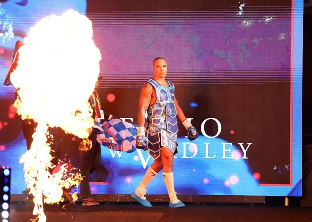 Fabio Wardley dressed all in blue makes his ring walk