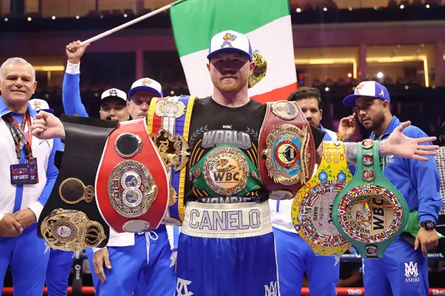 Saul 'Canelo' Alvarez with his championship belts