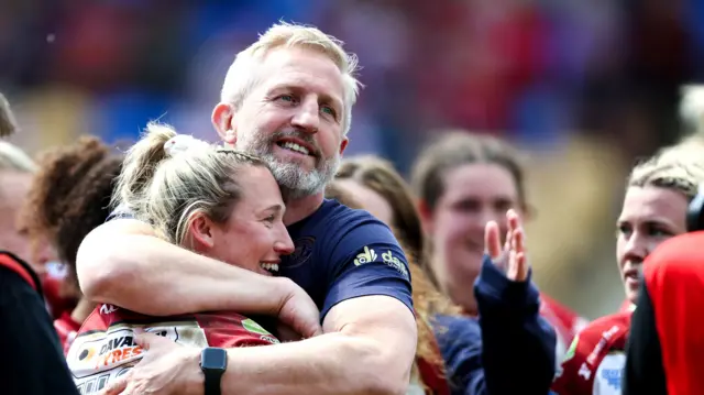 Denis Betts celebrates victory with Georgia Wilson