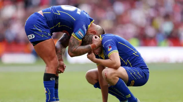 Paul Vaughan consoling James Harrison after Warrington Wolves loss to Wigan last year