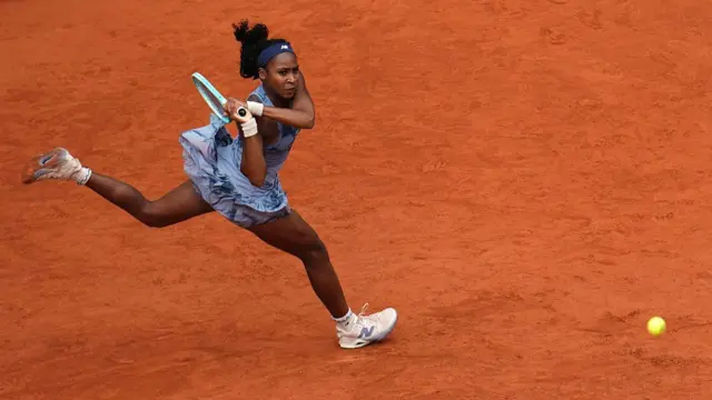 Coco Gauff plays a backhand return