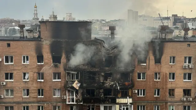 A view shows an burned and damaged apartment building hit by a Russian drone strike
