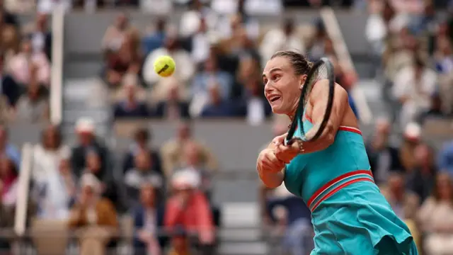 Aryna Sabalenka plays a backhand return