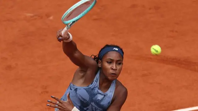 Coco Gauff serves