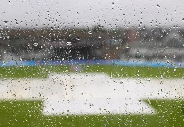 Rain sits on a window