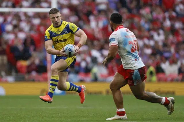 Warrington's George Williams runs with the ball
