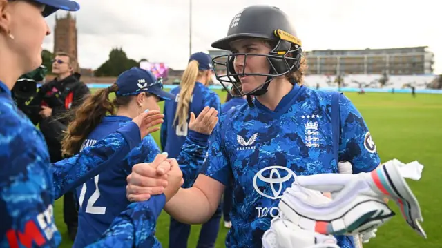 England batter Nat Sciver-Brunt is congratulated by team mates