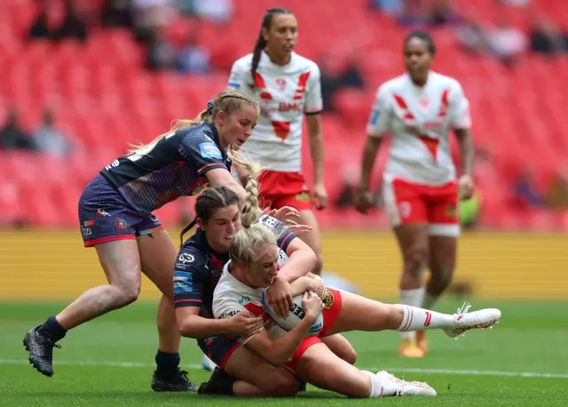 St Helens' Jodie Cunningham is tackled