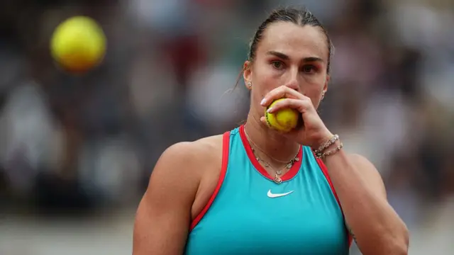 Aryna Sabalenka prepares to serve
