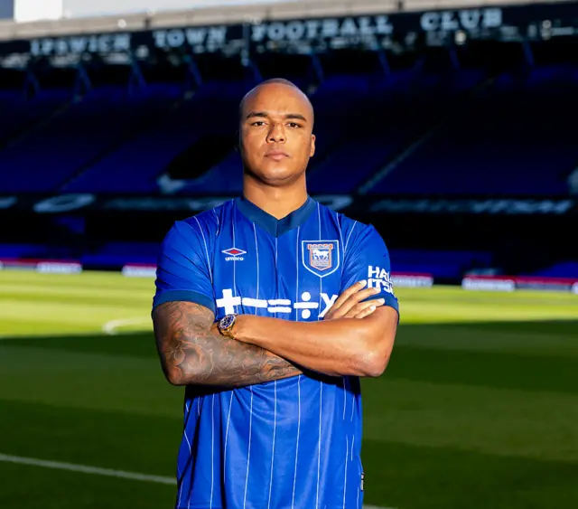 Fabio Wardely in an Ipswich shirt with his arms folded