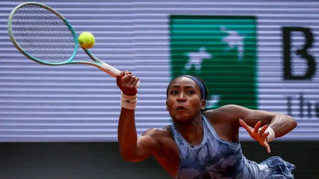 Coco Gauff plays a forehand return