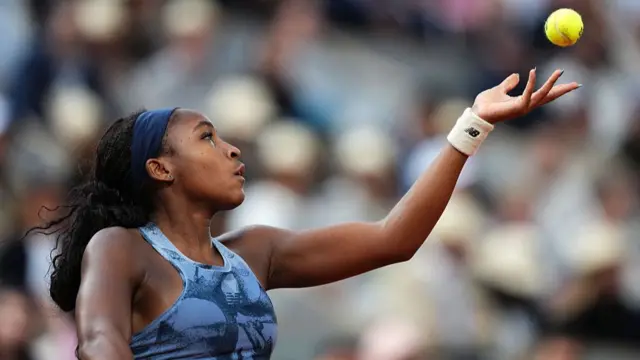 Coco Gauff serves