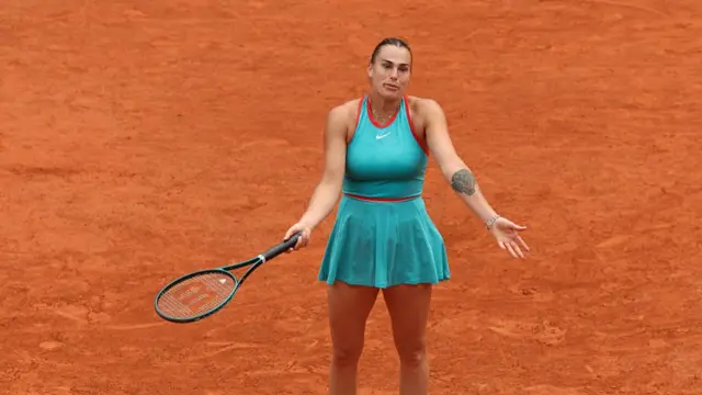 Aryna Sabalenka shrugs her shoulders