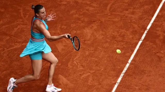 Aryna Sabalenka plays a forehand return