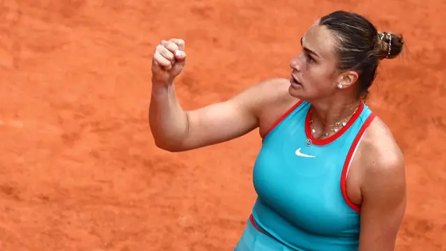 Aryna Sabalenka reacts after winning the first set