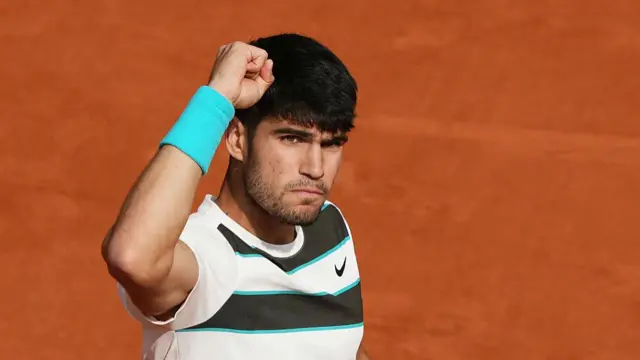 Carlos Alcaraz reacts after a point