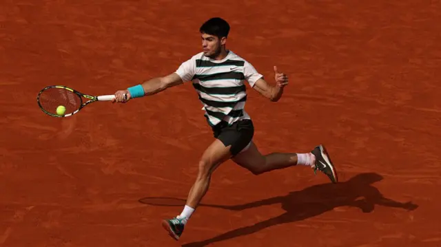 Carlos Alcaraz hits a forehand