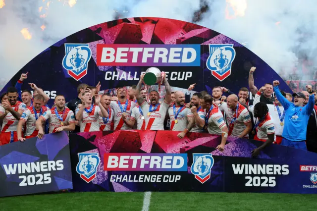 Hull Kingston Rovers players celebrate with the trophy after the Challenge Cup Final at Wembley Stadium, London.