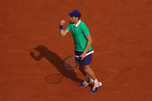 Jannik Sinner celebrates after set point
