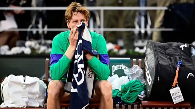 Jannik Sinner reacts after he lost the men's singles final