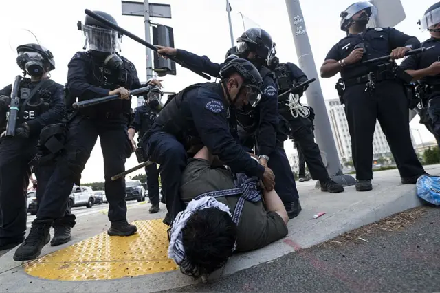 LOS ANGELES, CALIFORNIA - JUNE 06: LAPD officers arrest a protester outside of the Federal Building in downtown Los Angeles after the FBI and Ice Agents made arrests of illegal immigrants located in DTLA in Los Angeles, California, United States on June 06, 2025.