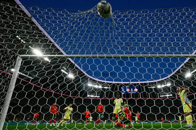 Martin Zubimendi (3rd L) scores the opening goal