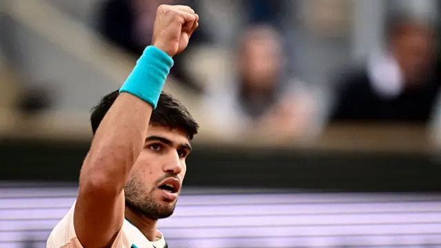 Carlos Alcaraz reacts after a point