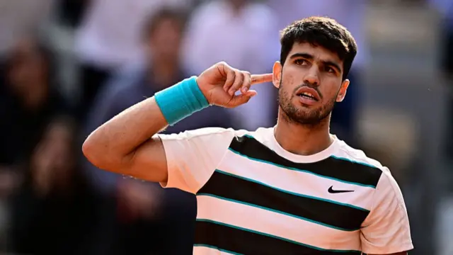 Carlos Alcaraz reacts after winning the third set