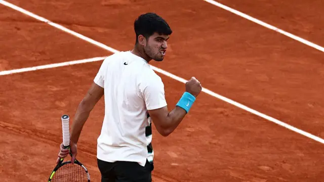 Carlos Alcaraz reacts after a point