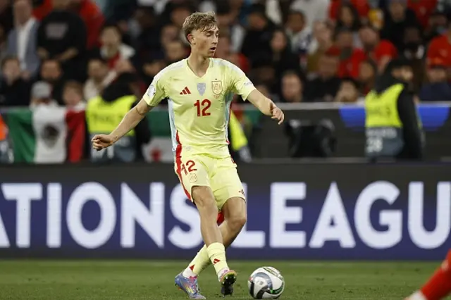 Dean Huijsen of Spain passes the ball