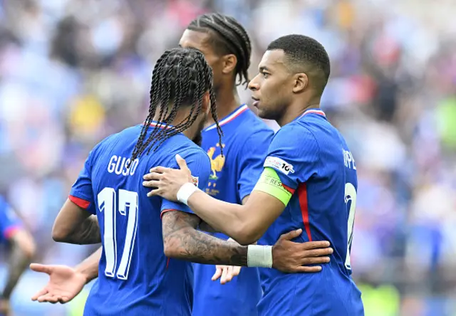Kylian Mbappe (R) celebrates