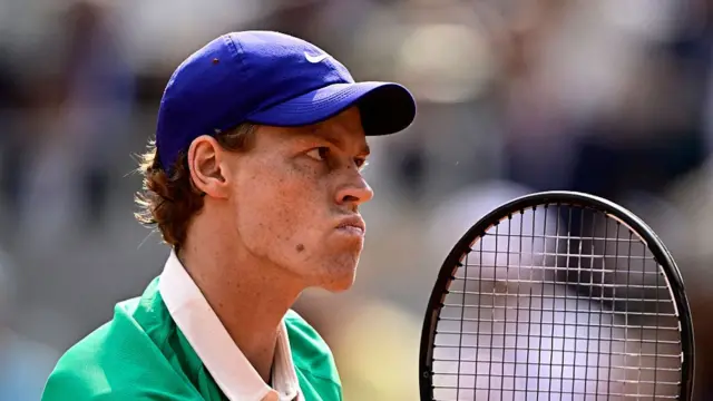 Jannik Sinner reacts after a point