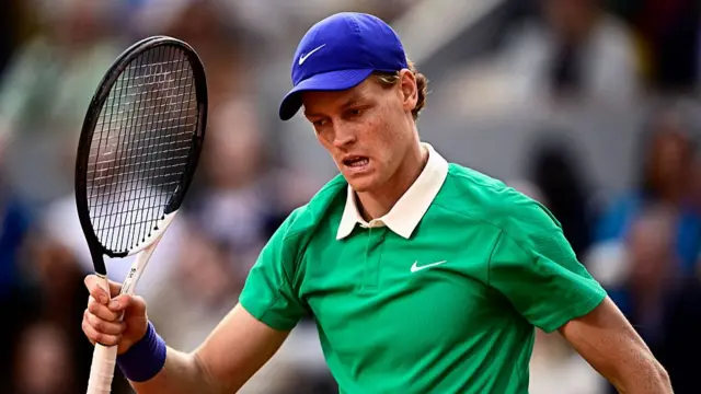 Jannik Sinner reacts after a point