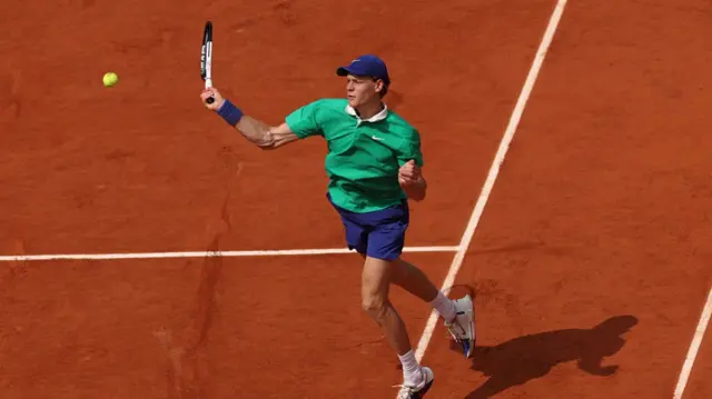 Jannik Sinner plays a forehand