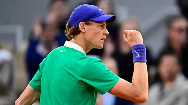 Jannik Sinner reacts after a point