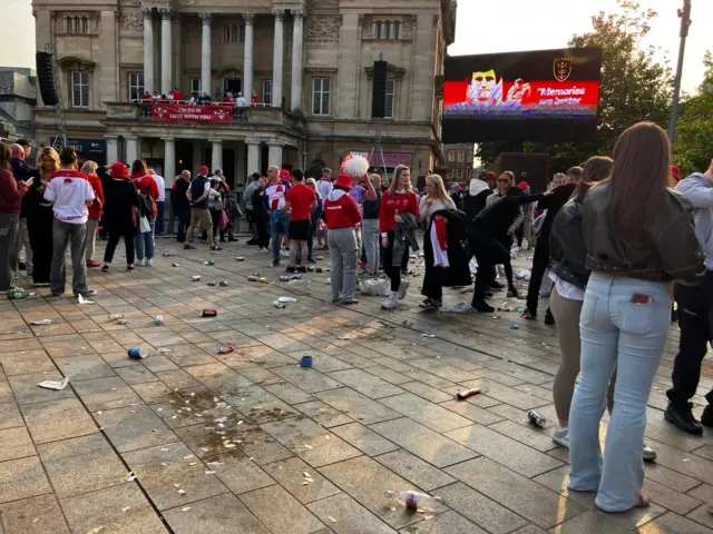 The aftermath of the Hull KR victory parade as the crowd leaves revealing rubbish and confetti scattered all over the floor.
