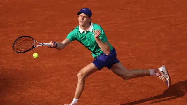 Jannik Sinner plays a forehand return