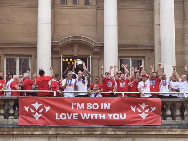 Hull KR lift the Challenge Cup on the balcony of Hull City Hall