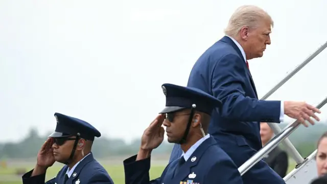 Donald Trump climbs Air Force One steps