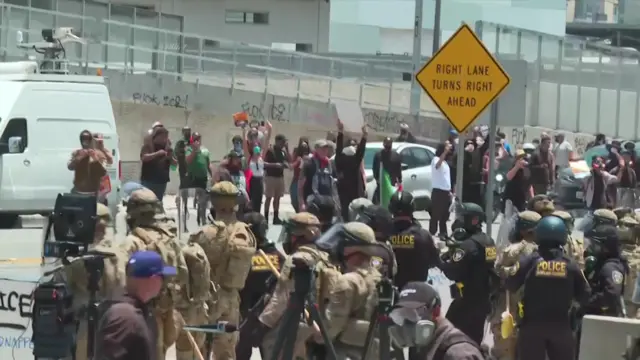 Protestors opposite National Guard troops in LA