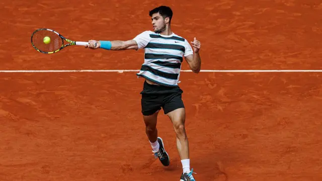 Carlos Alcaraz hits a forehand