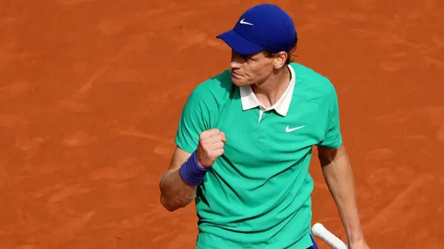 Jannik Sinner reacts after a point
