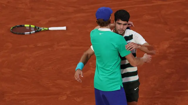 Carlos Alcaraz greets Jannik Sinner
