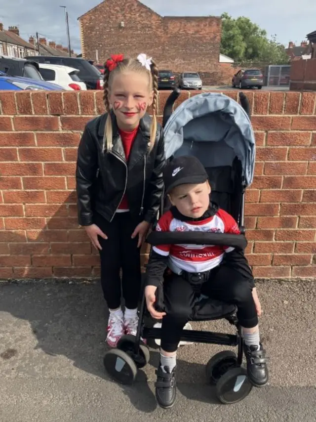 Lula and her brother both wearing Hull KR shirts