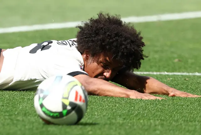 Karim Adeyemi falls after being tackled