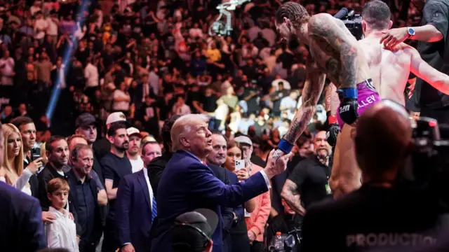 Donald Trump shakes hands with UFC fighter