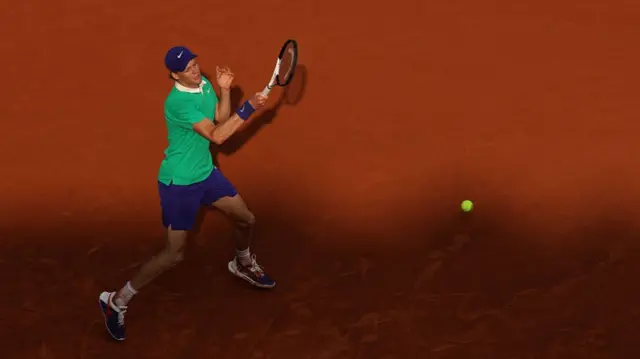 Jannik Sinner plays a forehand