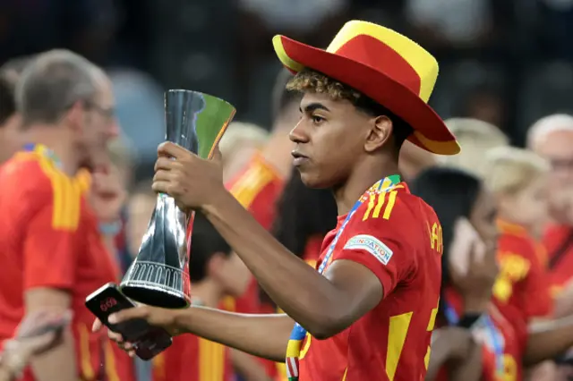 Lamine Yamal of Spain holds his trophy of 'Best young player of the tournament' following the UEFA EURO 2024 final