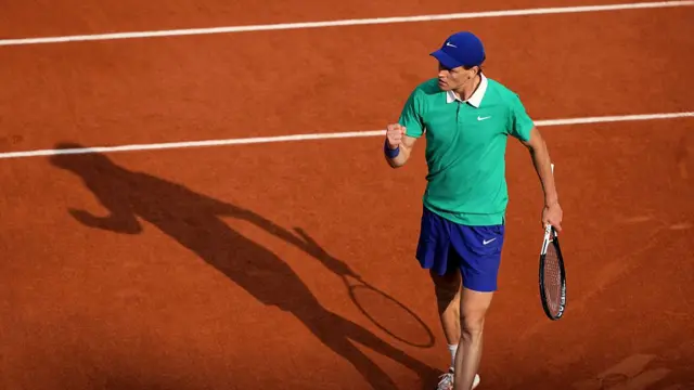 Jannik Sinner reacts after a point