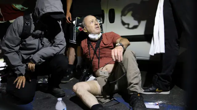 Nick Stern being treated after being shot
